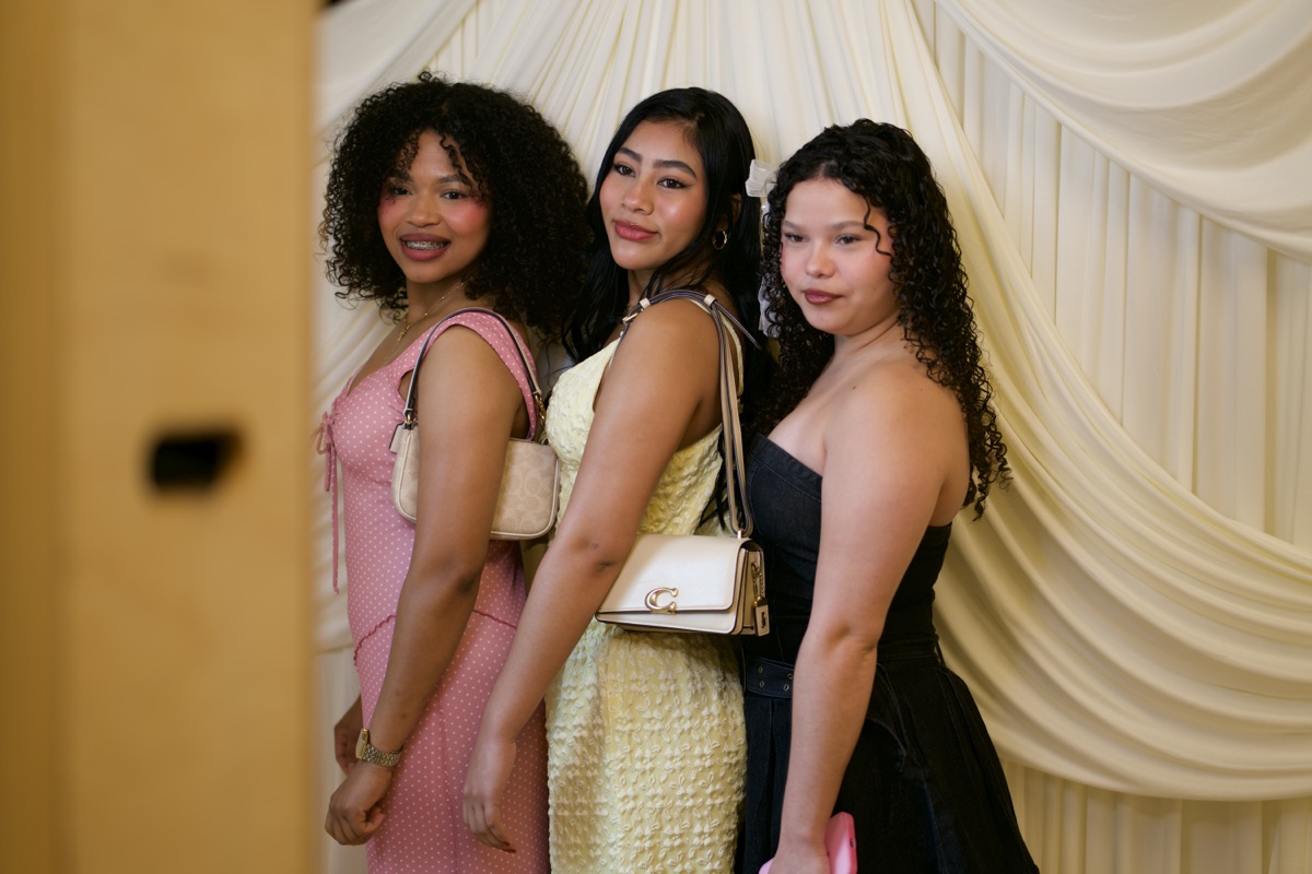 Guests posing together at a corporate event with the photo booth
